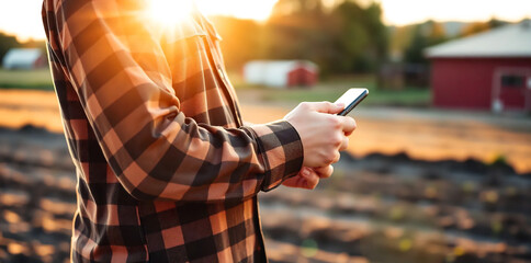 Close-up of a farmer checking weather data on a smartphone 