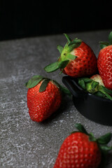 Fresh Strawberries on dark background. Summer red fruit with Copy space for text. Organic healthy eating.