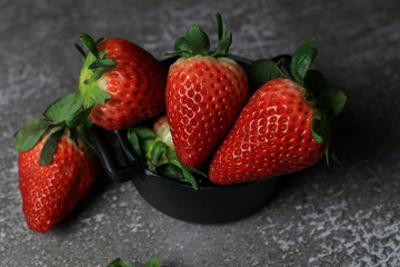 Fresh Strawberries on dark background. Summer red fruit with Copy space for text. Organic healthy eating.