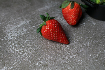 Fresh Strawberries on dark background. Summer red fruit with Copy space for text. Organic healthy eating.