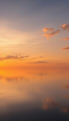 Fototapeta premium a lake at sunset with a cloudy sky