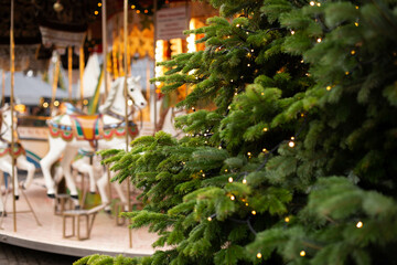Christmas carousels. Christmas market. Christmas tree in lights.