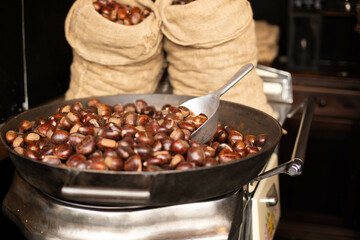 The making of roasted chestnuts.