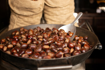The making of roasted chestnuts.