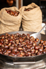 The making of roasted chestnuts.