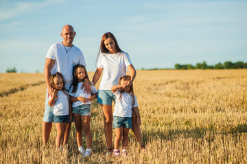Happy cheerful family has a day off.Family, and nature with flowers, field and trees for bonding, love and social media together outdoor. Woman, kid and man playing at park in summer for happy.