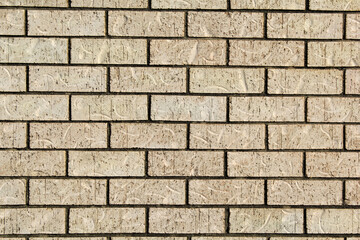 Light beige brick wall abstract textured background