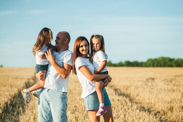 Happy cheerful family has a day off.Family, and nature with flowers, field and trees for bonding, love and social media together outdoor. Woman, kid and man playing at park in summer for happy.