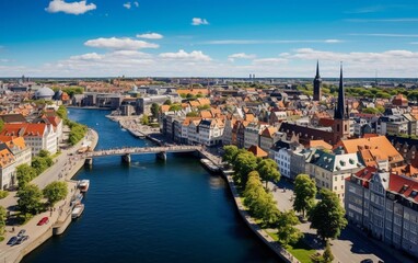 Fototapeta premium A scenic view of a city with rivers, bridges, and historic architecture under a clear blue sky.