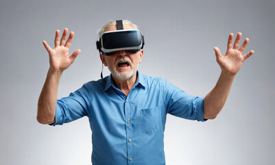 An older man wearing a virtual reality headset looks surprised and raises both his hands while experiencing VR