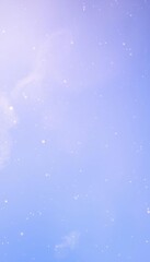 Obraz premium a snowboarder in the air with a blue sky in the background