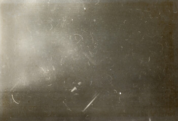 Abstract dirty or aging film. Dust particle and grain texture or dirt use for overlay film frame effect. Dust scratches effect for vintage film grunge textured effect design.