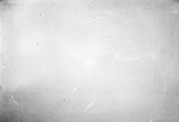 Abstract dirty or aging film. Dust particle and grain texture or dirt use for overlay film frame effect. Dust scratches effect for vintage film grunge textured effect design. © jakkapan