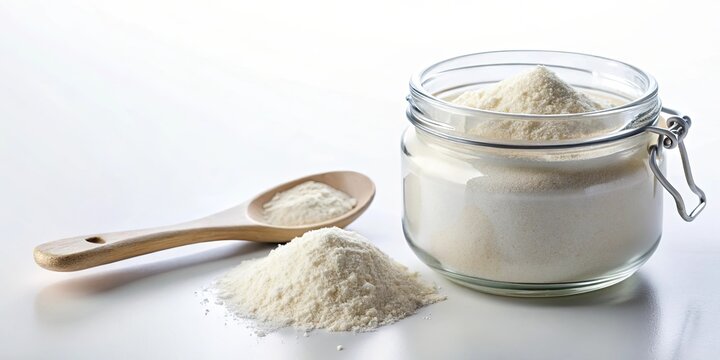 MSM powder in a clear jar with measuring spoon on white background, healthy, supplement, powder, MSM, jar