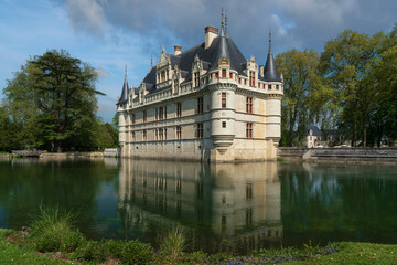 Fototapeta premium View of the Azay-le-Rideau Castle, a medieval castle above the bend of the Indre river, in the commune of the same name on a sunny summer day, Indre-et-Loire, France