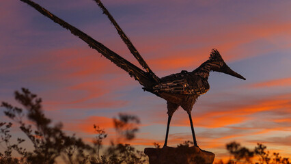 Colorful sky above roadrunner roadside attraction in Las Cruces, New Mexico USA