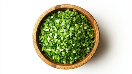 75.Overhead view of a wooden bowl filled with finely chopped spring onions, isolated on a white background. The chopped green onions are evenly spread within the bowl, their vivid color standing out