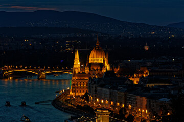 A mesmerizing 4K night view of Budapest’s Parliament and Danube River illuminated by city lights. Ideal for travel, tourism, and architectural themes, showcasing the elegance of this European capital 