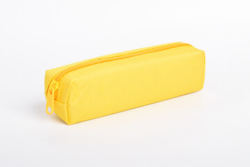 Bright yellow school pencil case isolated on white background. School stationery. Back to school. Copy space