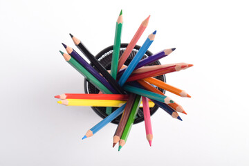 Colorful pencils in metal basket isolated on white background. Colorful pencils in container or pencil box. Education or back to school concept