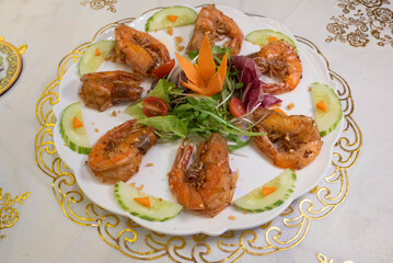 fried shrimp with lemon and vegetables
