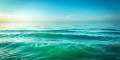 Obraz premium Gentle Ocean Waves Under A Clear Blue Sky