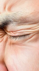 Fototapeta premium Close-up of a person's face showing tension and emotion, isolated on a white background.