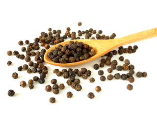 Pile of black peppercorns in wooden spoon