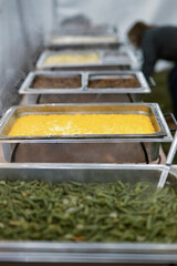 buffett line in silver warmers with corn and green beans