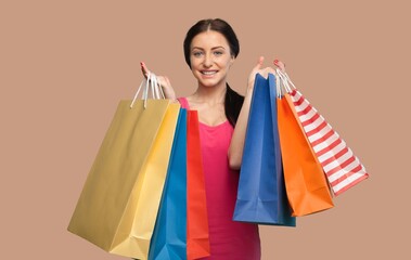 Beautiful young woman hold shopping bags