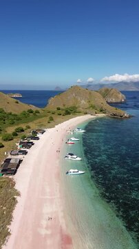 Drone shoot of Pink Beach in Labuan Bajo and travel tourism boat docking