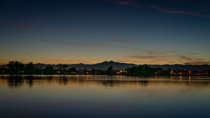 Fototapeta premium sunset over Rocky Mountains with Longs Peak and Windsor Lake in Colorado