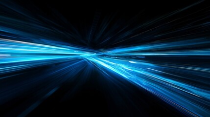 Dynamic blue light trails on black background depict abstract long exposure highway at night with illusion of speed.