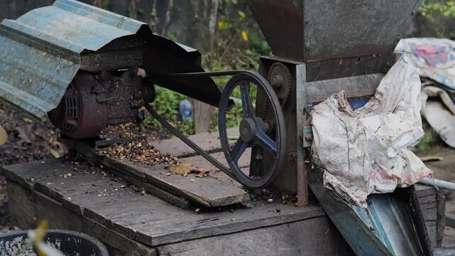 Manufacturing machine at coffee farm at sunny day, Bali, Indonesia. High quality 4k footage