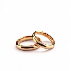 Two golden wedding rings isolated on a white background