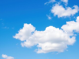 Clear blue sky with fluffy white clouds, perfect for background or texture, peaceful, fluffy clouds, atmosphere