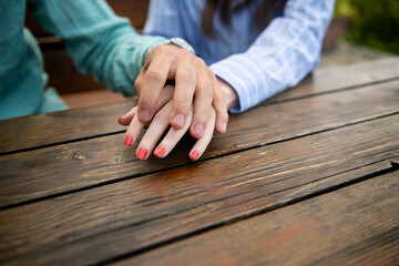 Obraz premium Close-up of couple touching hands showing love and care
