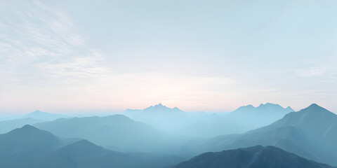 Fototapeta premium Serene Mountain Panorama: A breathtaking vista of majestic mountain peaks bathed in the soft glow of a misty sunrise, evoking a sense of peace and tranquility.
