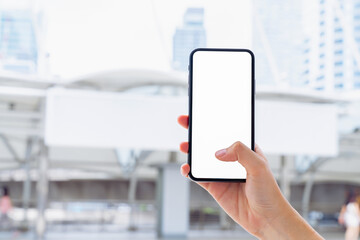 Hand holding smartphone mockup of blank screen, Take your screen to put on advertising.