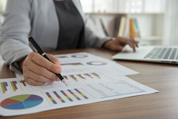 Business analyst checking in financial statement for audit internal control system. Accounting and...