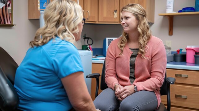 A patient engages with a nurse as she receives an HPV vaccine, promoting health and prevention in a welcoming clinic environment