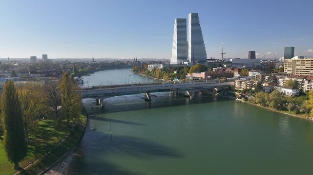Basel in autumn with rhine river and cityscape featuring roche towers, aerial view