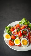 Fresh and colorful tomato lettuce onion and boiled egg salad on a white plate, healthy, white, fresh