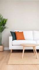 Modern living room with white couch, colorful pillows, and indoor plant in a cozy setting