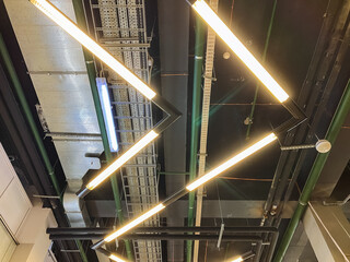 A ceiling that features an abundance of lights hanging down from it, creating a welllit ambiance...