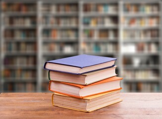 pile of old reading books on shelves in library
