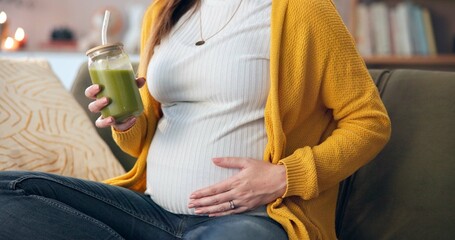 Pregnant woman, hand and comfort with green smoothie for nutrition, digestive health and wellness...