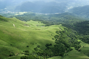 Obraz premium View of Haghartsin village and Aghstev river valley from Mount Dimats on sunny summer day. Tavush Province, Armenia..