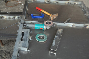 Metalworking tools on iron gate. Industry