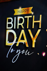 A vibrant birthday greeting featuring elegant typography and gold accents celebrating a special day